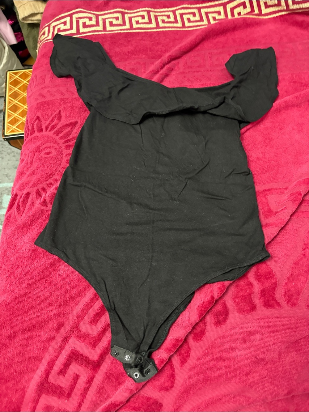 Black One-Piece Bodysuit with Ruffle Shoulders